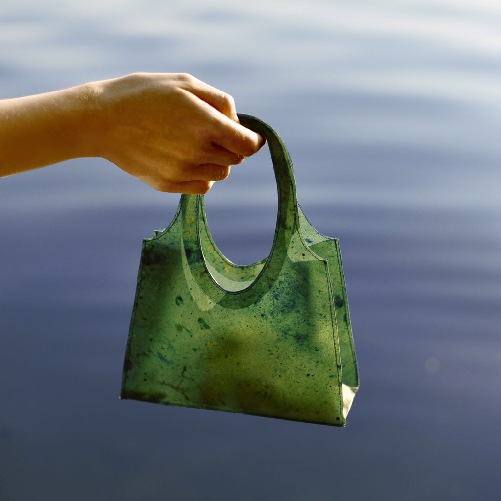 Berlin design students Lobke Beckfeld and Johanna Hehemeyer-Cürten have developed a translucent fruit-leather bag that dissolves in water and can be used to fertilise plants once it is no longer needed.