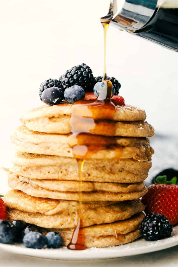 Fluffy Whole Wheat Pancakes are pillowy soft morsels of goodness! You are going to love this simple, easy, light but hearty pancake!