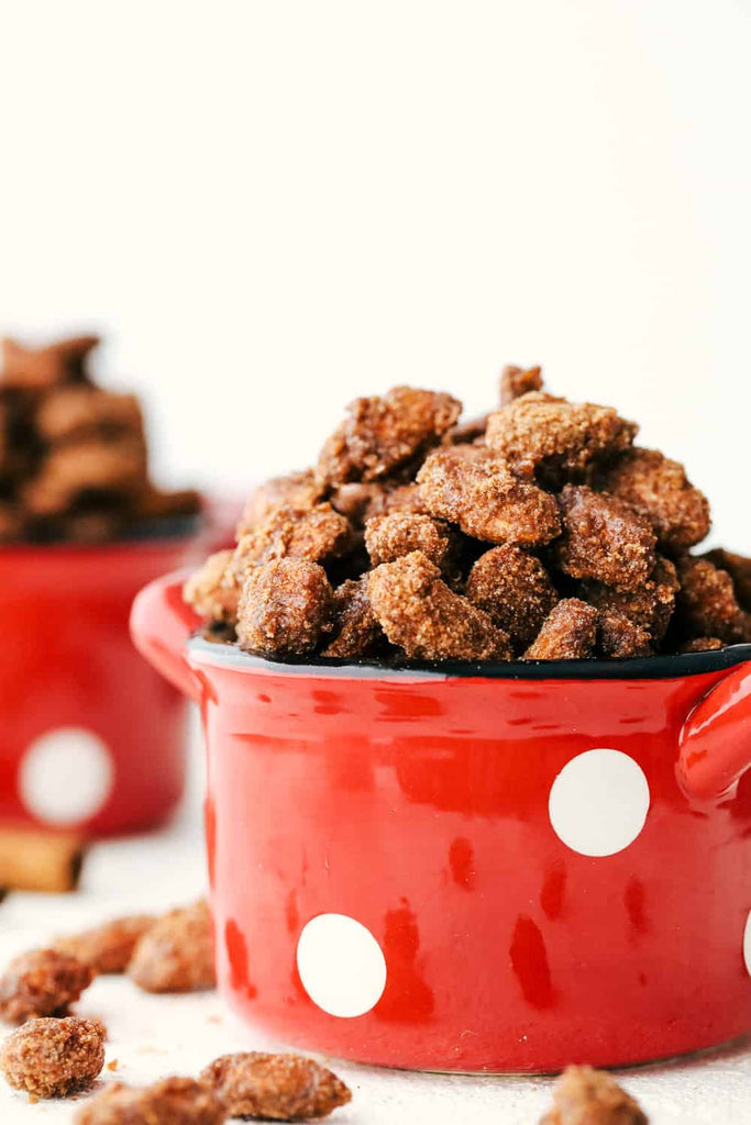 Slow Cooker Cinnamon Almonds are a crunchy, sweet treat made perfectly delicious in the crockpot! These tasty vittles are perfect for snacking, gift giving, and holiday partie